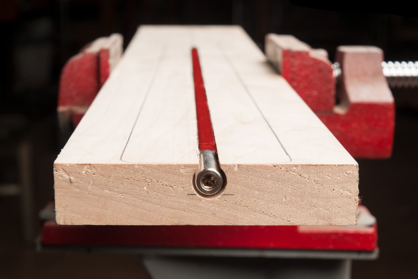 Neck blank in vise with truss rod installed